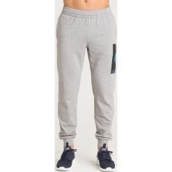 SPODNIE DRESOWE EA7 Emporio Armani. Szare spodnie sportowe męskie EA7 Emporio Armani, l, bez wzorów, z dresówki. Za 317.00 zł.