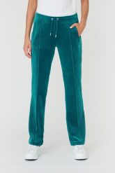 JUICY COUTURE Turkusowe spodnie Tina. Niebieskie spodnie dresowe damskie Juicy Couture, bez wzorów, z dresówki. W wyprzedaży za 299.99 zł.