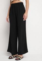 Czarne Spodnie Palazzo o Szerokim Kroju z Wysokim Stanem Aravenna. Czarne spodnie materiałowe damskie Born2be, z aplikacjami, z jeansu, eleganckie, z podwyższonym stanem. Za 39.99 zł.