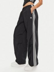 Adidas Spodnie dresowe 3-Stripes Woven Parachute IY7251 Czarny Loose Fit. Czarne spodnie dresowe damskie Adidas, bez wzorów, z dresówki. Za 279.99 zł.