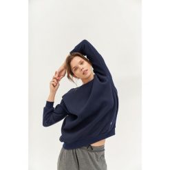 Bluza do jogi Moonholi Cozy AF Oversize Sweatshirt z bawełnianej dzianiny. Czerwone bluzy damskie MOONHOLI, s, bez wzorów, z bawełny, sportowe, bez ramiączek, bez kaptura. Za 429.00 zł.