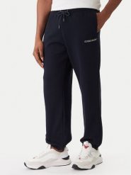 Guess Jeans Spodnie dresowe M6RB70 KCPR1 Granatowy Regular Fit. Niebieskie spodnie sportowe męskie Guess Jeans, m, z aplikacjami, z bawełny. Za 299.99 zł.