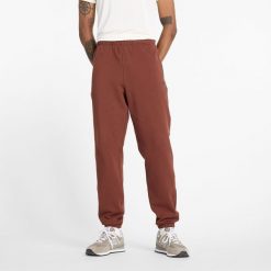 Spodnie męskie New Balance MP41508ROK – brązowe. Brązowe spodnie sportowe męskie New Balance, m, bez wzorów, z bawełny. Za 199.99 zł.