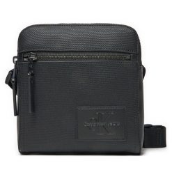 Saszetka Calvin Klein Jeans. Czarne saszetki i nerki męskie Calvin Klein Jeans, z jeansu, małe. Za 209.99 zł.