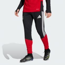 Spodnie Germany 26 Tiro Training. Czarne spodnie sportowe męskie Adidas, bez wzorów, do piłki nożnej. Za 279.00 zł.
