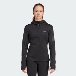 Bluza Own The Run Winterized Hooded Half-Zip. Czarne bluzy damskie Adidas, s, bez wzorów, bez ramiączek, z kapturem. W wyprzedaży za 225.40 zł.