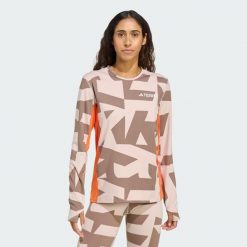 Koszulka z długim rękawem Multi Synthetic Base Layer. Brązowe bluzki damskie Adidas, uniwersalny, bez wzorów, sportowe, bez kołnierzyka, bez ramiączek. Za 219.00 zł.