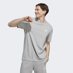 Koszulka sportowa męska adidas Essentials. Żółte koszulki sportowe męskie Adidas, m, bez wzorów, bez ramiączek, do piłki nożnej. Za 96.00 zł.
