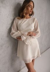 Beżowa Sukienka Vices Ozdobiona Transparentnymi Rękawami i Kropkami Celziva. Brązowe sukienki damskie Renee, na co dzień, l, bez wzorów, z koronki, eleganckie, bez kołnierzyka, bez ramiączek, mini, dopasowane. Za 119.99 zł.