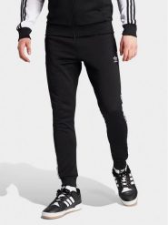 Adidas Spodnie dresowe adicolor Classics SST IL2488 Czarny Slim Fit. Czarne spodnie sportowe męskie Adidas, m, bez wzorów, z bawełny. Za 189.99 zł.