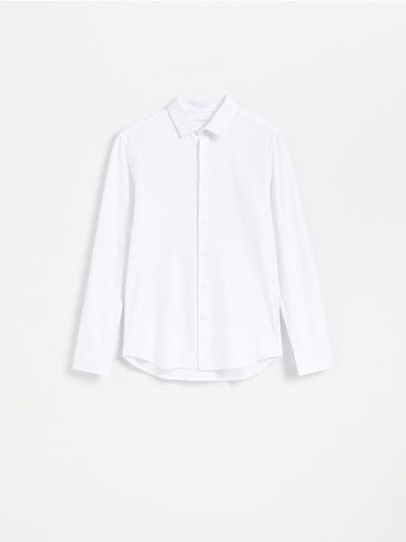 Gładka koszula slim fit - biały. Białe koszule męskie Reserved, l, bez wzorów, z bawełny, bez kołnierzyka, bez ramiączek. Za 129.99 zł.