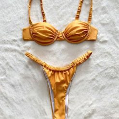 Bikini z marszczeniem elastyczne na plażę i basen Slavejka. Żółte bikini Intica, bez wzorów. Za 159.00 zł.