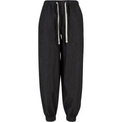 Damskie spodnie dresowe Urban Classics. Czarne spodnie dresowe damskie Urban Classics, bez wzorów, z bawełny, sportowe, długie, do biegania. Za 147.00 zł.