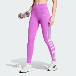 Legginsy Optime 3-Stripes Full-Length. Fioletowe bielizna sportowa damska Adidas, bez wzorów, z materiału. W wyprzedaży za 201.90 zł.