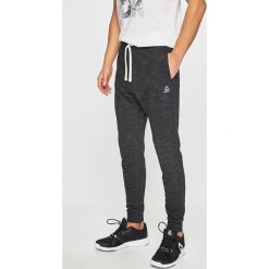 Reebok - Spodnie. Czarne spodnie sportowe męskie Reebok, m, bez wzorów, z bawełny, climacool (adidas). W wyprzedaży za 139.90 zł.