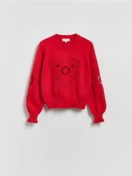 Sweter z ażurowym motywem - czerwony. Czerwone swetry nierozpinane damskie Reserved, l, w ażurowe wzory, z bawełny, bez kołnierzyka, bez ramiączek. Za 199.99 zł.