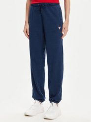 Guess Jeans Spodnie dresowe W5YB65 KCXQ1 Granatowy Regular Fit. Niebieskie spodnie dresowe damskie Guess Jeans, z aplikacjami, z bawełny. Za 269.99 zł.