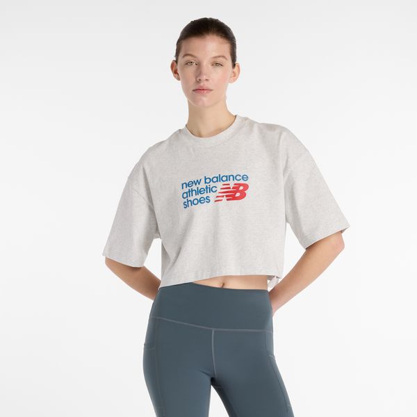 Koszulka damska New Balance WT51908AHH – szara. Szare bluzki damskie New Balance, s, bez wzorów, z bawełny, bez kołnierzyka, bez ramiączek. Za 169.99 zł.