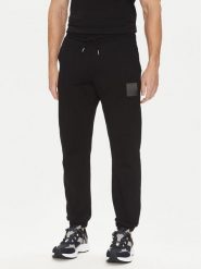HUGO Spodnie dresowe Dusplitan 50542866 Czarny Relaxed Fit. Czarne spodnie sportowe męskie Hugo, m, bez wzorów, z bawełny. Za 349.99 zł.