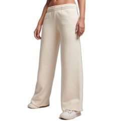 Damskie proste spodnie dresowe w odcieniu wyblakłym Superdry. Szare spodnie dresowe damskie Superdry, bez wzorów, z dresówki, sportowe, długie. W wyprzedaży za 228.50 zł.