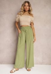 Jasnozielone Spodnie z Bawełny Typu Palazzo High Waist z Gumką w Talii Nelsaria. Zielone spodnie materiałowe damskie Renee, bez wzorów, z bawełny, eleganckie, z podwyższonym stanem. Za 39.99 zł.