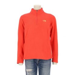 Damski sweter polarowy TNF koralowy. Brązowe swetry nierozpinane damskie The North Face, l, bez wzorów, z polaru, sportowe, bez kołnierzyka, bez ramiączek. Za 127.76 zł.