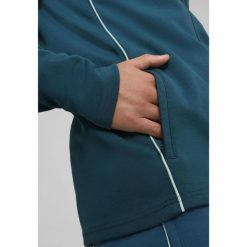 Kurtka z dresu OM 2024/25. Niebieskie kurtki męskie Puma, bez wzorów, z dresówki, sportowe, bez kaptura. W wyprzedaży za 278.30 zł.