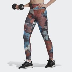 Damskie legginsy z wysokim stanem z nadrukiem adidas Training Essentials. Czerwone legginsy damskie Adidas, bez wzorów. W wyprzedaży za 148.65 zł.