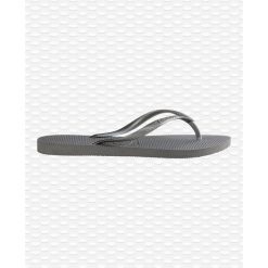 Klapki damskie Havaianas Slim. Szare klapki damskie Havaianas, na lato, bez wzorów, z gumy, eleganckie, bez obcasa, bez zapięcia. Za 87.00 zł.