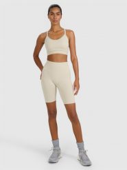 4F Legginsy kolarki treningowe bezszwowe damskie - beżowe XS/S. Brązowe legginsy sportowe damskie 4F, l, bez wzorów, z dzianiny, z podwyższonym stanem, krótkie, na fitness i siłownię. Za 119.99 zł.