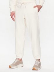 New Balance Spodnie dresowe MP23551 Écru Relaxed Fit. Spodnie sportowe męskie New Balance, m, bez wzorów, z bawełny. Za 279.99 zł.