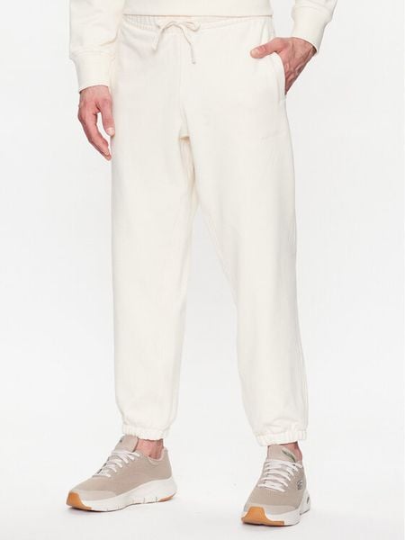 New Balance Spodnie dresowe MP23551 Écru Relaxed Fit. Spodnie sportowe męskie New Balance, m, bez wzorów, z bawełny. Za 219.99 zł.