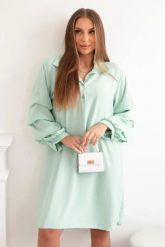 Sukienka oversize z ozdobnym rękawem jasno miętowa. Zielone sukienki damskie Włoski, na co dzień, l, bez wzorów, z elastanu, eleganckie, bez kołnierzyka, bez ramiączek, oversize. Za 133.82 zł.