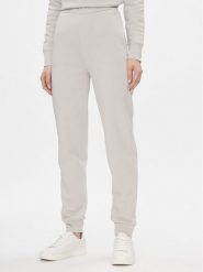 Calvin Klein Spodnie dresowe Metallic Micro Logo Jogger K20K206965 Beżowy Regular Fit. Brązowe spodnie dresowe damskie Calvin Klein, bez wzorów, z dresówki. Za 519.99 zł.
