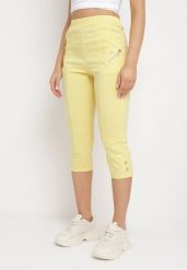 Żółte Spodnie 3/4 z Elastyczną Gumką w Pasie i Suwakami Leazira. Żółte spodnie materiałowe damskie Born2be, bez wzorów, z jeansu, eleganckie. Za 49.99 zł.