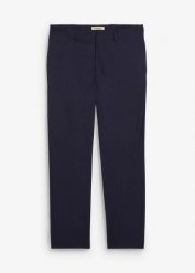 Spodnie garniturowe o kroju relaxed fit. Niebieskie eleganckie spodnie męskie bonprix, bez wzorów. Za 169.99 zł.