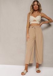 Beżowe Spodnie High Waist z Szerokimi Nogawkami z Wiskozą Wykończone Gumką w Talii Crisantas. Brązowe spodnie sportowe damskie Renee, bez wzorów, z jeansu, biznesowe, z podwyższonym stanem. Za 29.99 zł.