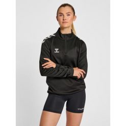 Damska bluza rozpinana 1/4 Hummel Core XK. Czarne bluzy damskie Hummel, bez wzorów, sportowe, bez ramiączek, bez kaptura. Za 227.50 zł.