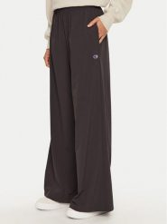Champion Spodnie dresowe 117472 Czarny Wide Leg. Czarne spodnie dresowe damskie Champion, bez wzorów, z dresówki. Za 189.99 zł.