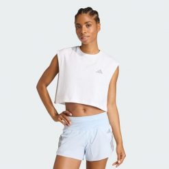 Koszulka adi365 Running Essentials Crop. Białe bluzki damskie Adidas, bez wzorów, sportowe, bez kołnierzyka, bez ramiączek. Za 99.95 zł.