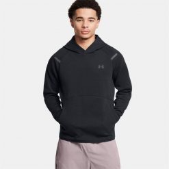 Bluza Under Armour Unstoppable Fleece Jgr. Czarne bluzy męskie Under Armour, bez wzorów, sportowe, bez ramiączek, bez kaptura. Za 446.80 zł.