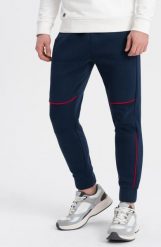 Ombre Spodnie męskie dresowe z kontrastowymi przeszyciami - granatowe V4 OM-PASK-0145 L. Spodnie sportowe męskie Ombre, l, bez wzorów, z dresówki. Za 59.99 zł.
