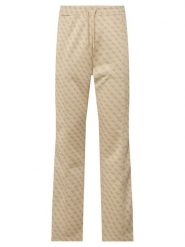 Guess Spodnie dresowe Z5BB07 K2042 Beżowy Regular Fit. Brązowe spodnie sportowe męskie Guess, l, z aplikacjami, z dresówki. Za 524.99 zł.