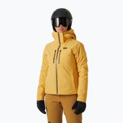 Kurtka narciarska damska Helly Hansen Alphelia Lifaloft sand. Żółte kurtki sportowe damskie Helly Hansen, na zimę, bez wzorów, bez ramiączek, bez kaptura, narciarskie. Za 2,499.00 zł.