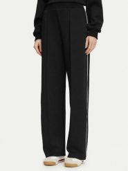 Guess Spodnie dresowe V6BB05 K6265 Czarny Regular Fit. Czarne spodnie dresowe damskie Guess, z aplikacjami, z dresówki. Za 394.99 zł.