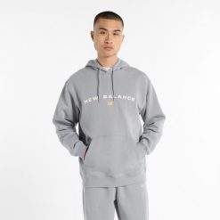 Bluza męska New Balance MT51516YST – szara. Szare bluzy męskie New Balance, m, z aplikacjami, z bawełny, z kapturem. Za 189.99 zł.