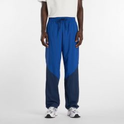 Spodnie męskie New Balance MB61R010NNY – niebieskie. Niebieskie spodnie sportowe męskie New Balance, m, bez wzorów, z materiału. Za 389.99 zł.