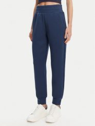 Guess Spodnie dresowe W5YB11 KBYE2 Granatowy Regular Fit. Niebieskie spodnie dresowe damskie Guess, z aplikacjami, z dresówki. Za 299.99 zł.
