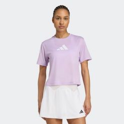 Koszulka fitness damska ADIDAS. Fioletowe bluzki damskie Adidas, s, bez wzorów, z materiału, sportowe, bez kołnierzyka, bez ramiączek. W wyprzedaży za 69.99 zł.