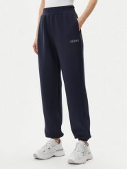 Guess Spodnie dresowe V4BB13 K7UW2 Granatowy Regular Fit. Niebieskie spodnie dresowe damskie Guess, z aplikacjami, z dresówki. Za 299.99 zł.